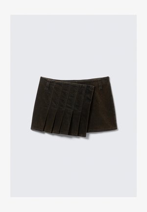 Black denim skirt featuring a pleated design with five vertical folds, a waistband, and a smooth texture. No additional hardware visible.