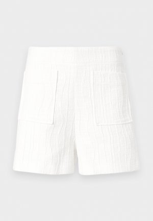 Λευκά σορτς από υφασμάτινη υφή με φαρδιά ελαστική μέση και δύο μεγάλες τσέπες στο μπροστινό μέρος.