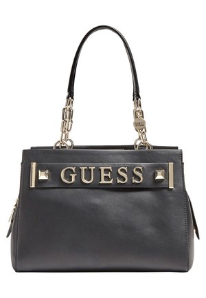 Black leather Guess handbag with gold chain handles, gold logo lettering on front, and decorative gold studs.