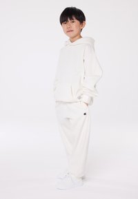 Champion EXCLUSIVE HOODIE UNISEX - Sportinis megztinis - off-white