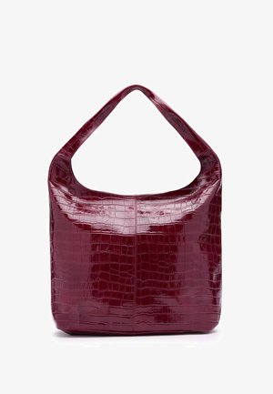Glossy burgundy handbag with crocodile texture, wide strap, and a soft, rounded rectangular shape.