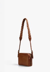 Brown leather crossbody bag with a braided strap, rectangular shape, and zippered pocket accent. Smooth texture with a subtle shine.