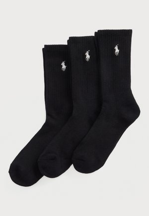 Trois paires de chaussettes en coton noir à mi-mollet avec une texture côtelée, arborant un petit logo en argent d'un cheval sur chaque chaussette.