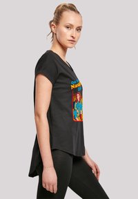 Black t-shirt with a rounded neckline, short sleeves, and a colorful graphic featuring bold text and a character illustration.