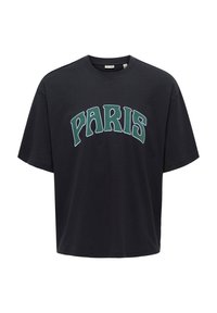 Zwart katoenen t-shirt met een grote groene "PARIS" print op de borst. Korte mouwen en een losse pasvorm.
