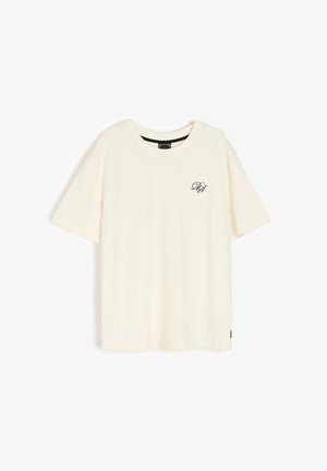 Kremowy bawełniany t-shirt z okrągłym dekoltem i krótkimi rękawami. Posiada czarne logo na lewej piersi oraz standardowy krój.