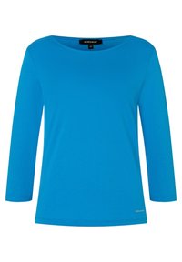 Blue long-sleeve shirt made of cotton. Features a round neckline and simple design. Label visible on the inside near the neck.