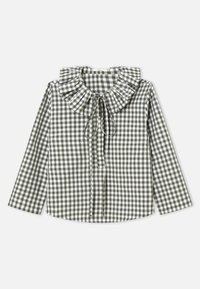 Zelena i bijela bluza od tkanine gingham s naboranim ovratnikom, dugim rukavima i vezicom na izrezu. Pamučni materijal, strukturirani kroj.