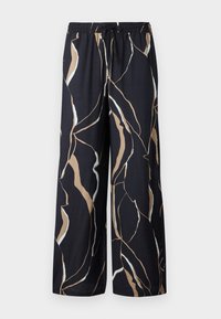 Pantalons larges en tissu bleu marine foncé, avec un motif abstrait audacieux en beige et blanc. Taille élastique avec détail de cordon.