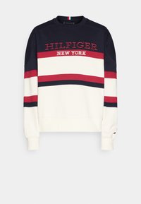 Felpa in navy, crema e rosso. Presenta strisce orizzontali, "HILFIGER NEW YORK" ricamato sul davanti e polsini a costine.