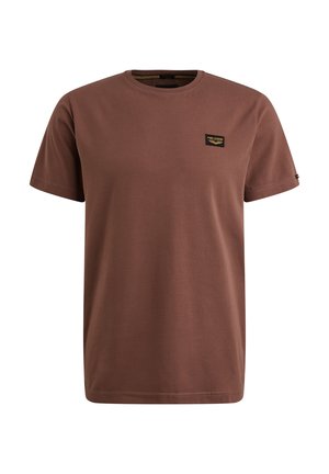 Brown cotton t-shirt with a round neck, short sleeves, and a small black and gold label on the left chest. Smooth texture, simple design.