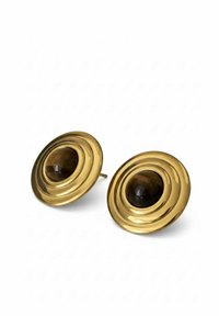 Gold-tone circular earrings with concentric raised rings and a central dark brown cabochon stone. Polished metallic finish, post-back design.