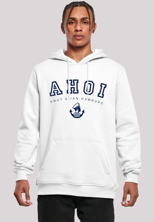 White hoodie featuring "AHOI" in navy lettering, with a graphic of a sailor and anchors. Includes a front pocket and ribbed cuffs.