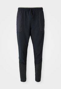 Schwarze Sporthose mit elastischem Bund, Kordelzug, seitlichen Taschen und gestreiften, strukturierten Akzenten an den unteren Beinen.
