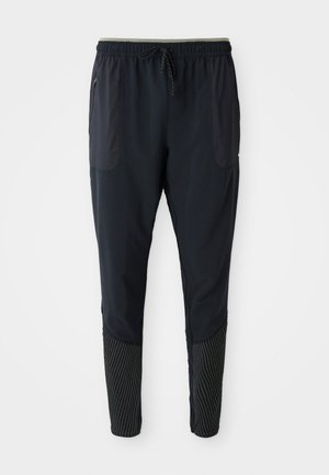 Pantalones deportivos negros con una cintura elástica, cordón ajustable, bolsillos laterales y acentos texturizados a rayas en las piernas inferiores.