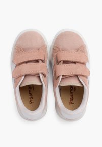 Light pink suede sneakers with white accents, featuring two Velcro straps, round toe, and cushioned insole. Smooth texture and minimal design.