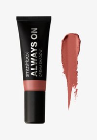 Tube noir avec des accents roses étiqueté "Smashbox Always On Cream Shadow," à côté d'un échantillon de pigment rose poussiéreux doux.