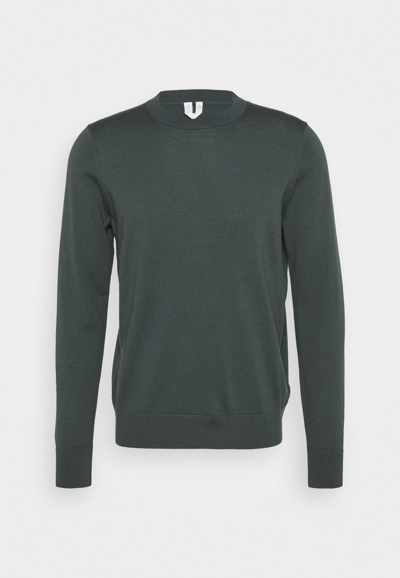 Pull vert foncé à manches longues avec col rond, poignets et ourlet côtelés, présenté sur un fond clair uni.