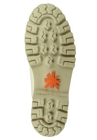 Jasny kremowy podeszwa z rugged wzorem bieżnika, z pomarańczowym logo gwiazdy i wytłoczonym napisem "THE ART COMPANY." Teksturowana powierzchnia zapewniająca przyczepność.