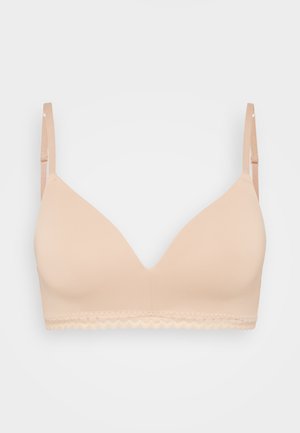 Beige podprsenka s polstrováním a hladkým povrchem, s nastavitelnými ramínky a krajkovým lemem podél dolního okraje. V-čkový design pro bezproblémový vzhled.
