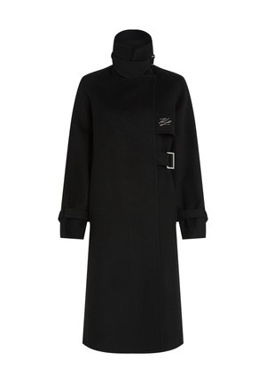 Black coat featuring a high collar, long sleeves with rolled cuffs, side buckle detail, and a sleek, straight silhouette.