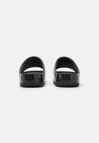 Nike Sportswear CALM SLIDE UNISEX - Sandály do bazénu - black/dark obsidian