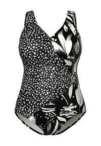 Sort-hvid badedragt i ét stykke med kontrasterende blomster- og pletmønstre samt en dekorativ spænde foran.
