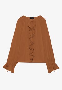 Brun langermet bluse i lett stoff med rufsete front, snøring i halsen og utsvingte ermer med knyttinger.