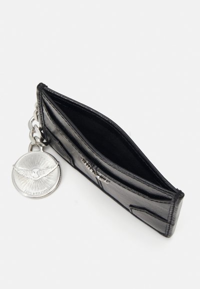 Black leather wallet with a sleek design, textured exterior, silver chain hardware, and a decorative silver medallion attached.