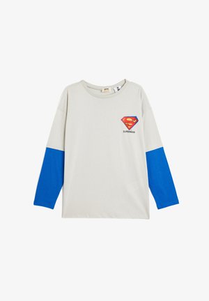 Long-sleeve shirt in light gray cotton with blue sleeves. Features a Superman logo on the chest and a round neckline.