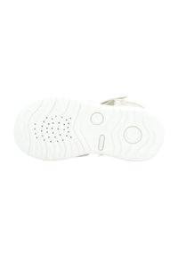 Suela de zapato blanca con patrones de agarre texturizados y acentos circulares. Diseño ligero con un material flexible y duradero.