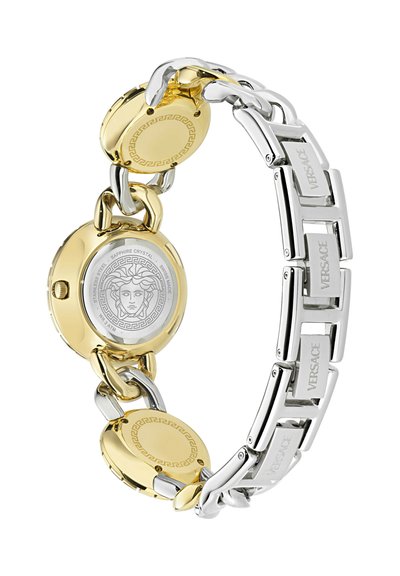 Kuldse ja hõbedase roostevabast terasest kell, millel on ümmargune korpus, safiirkristall, ühendatud rihm ja Medusa logo tagaküljel.