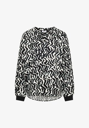 Zwart-witte blouse met lange mouwen, abstract zigzagpatroon, V-hals en geribde manchetten. Zacht materiaal met een ontspannen pasvorm.