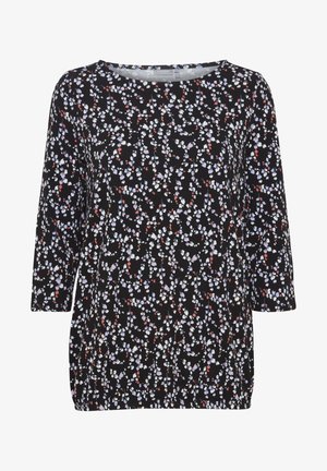 Melnā blūze ar ziedu rakstu purpursarkanos, zilos un sarkanajos toņos. Ar noapaļotu izgriezumu un trīs ceturtdaļu garuma piedurknēm.