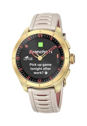 Smartwatch con cassa dorata e cinturino beige che mostra un messaggio WhatsApp: "Partita stasera dopo il lavoro?" e lancette analogiche.