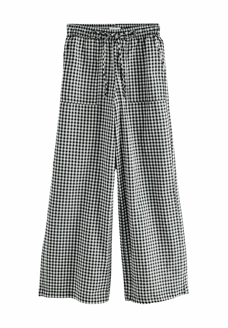 Pantalons larges avec une ceinture élastique, présentant un motif à carreaux vichy noir et blanc et deux grandes poches avant.