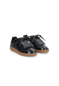 Black patent leather sneakers with black textile accents, fringed detailing, and shiny black laces. Gum rubber sole for added traction.
