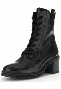 Black ankle boots with a glossy finish, featuring a lace-up front, rounded toe, textured side panels, and a sturdy block heel.