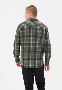 Groene geruite shirt met lange mouwen, met witte lijnen en knoopmanchetten. Het ontwerp heeft een klassieke kraag en een rechte onderkant aan de achterkant.