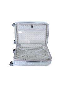 Valise rigide bleu clair avec un extérieur texturé, double roues et poche en maille intérieure. Dotée de sangles croisées et d'une fermeture éclair verrouillable.