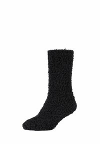 Schwarze, flauschige Socken mit einer strukturierten, struppigen Oberfläche. Knöchelhöhe mit einem weichen, warmen Aussehen und ohne sichtbare Beschläge oder Muster.
