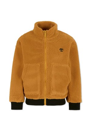 Veste en polaire orange avec un col montant, fermeture éclair à l'avant, deux grandes poches plaquées, et des poignets et un ourlet en bord-côte noir. Présente un logo sur la poitrine.