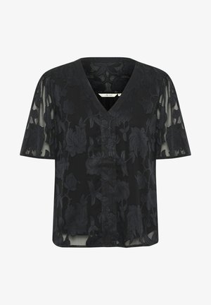 Mustmustel kauakonnaga must lilleline bluus V-kaelusega ja lühikeste varrukatega, millel on läbipaistev kiht ja tekstuuriga lillemustrid. Lõtv siluett.