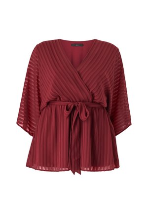 Red pleated wrap top with wide sleeves, adjustable tie belt at the waist, and a textured, lightweight fabric.