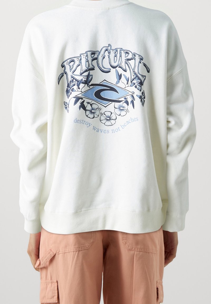 Biała bluza z okrągłym dekoltem z niebieskim graficznym wzorem kwiatowym, logo "Rip Curl" oraz napisem "niszcz fale, nie plaże" na plecach.