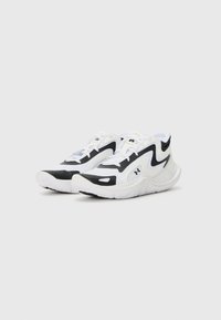 Black and white athletic shoes with a mesh upper, zigzag design, and rubber sole. Features laces and a logo on the side.