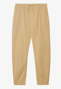 Jasnożółte spodnie z elastycznym pasem i sznurkiem. Zwężane nogawki z elastycznymi ściągaczami i bocznymi kieszeniami. Gładka faktura materiału.