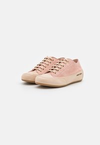 Blush pink suede sneakers with a rounded toe, lace-up design, gold eyelets, and a rubber sole. Features a textured upper and logo detail.