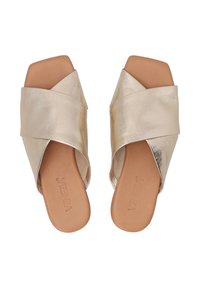 Gold metallic slide sandals with crisscross straps, square toe design, and a smooth texture. Brown insole with logo detailing.