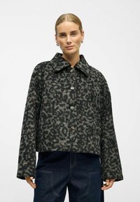 Cropped leopard print jacket in dark tones, featuring a wide collar, long sleeves, and large buttons with a textured fabric finish.